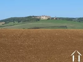 View from garden to medieval village Château de Chateauneuf en Auxois