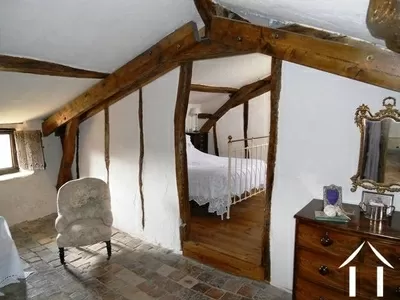 The master bedroom has its own lounge area. Beyond the bedroom there is a large loft space which would make another bedroom or extend the size of the current bedroom. 