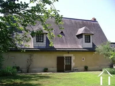 The house is of classic styling with a high pitch ardoise slate roof and tuffeau limestone (the local stone) construction.
