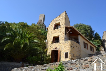 Entre château, église et Orb plage

Situated on a hillside in the heart of the historic part of Roquebrun, this pretty old house has been perfectly renovated with beautiful woodwork, giving it a warm and comfortable atmosphere. Ref # EG09-6881 