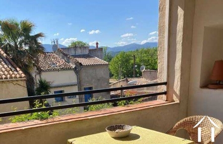 In the heart of Cessenon, charming and historic  village house with garden and loggia and views. Ref # EG09-6971 