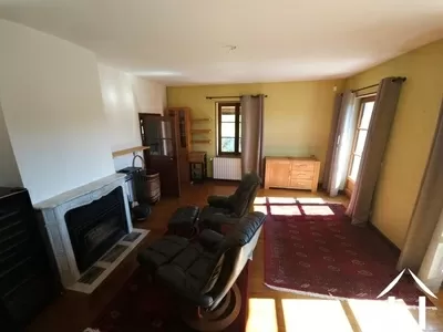 Living room with fireplace and access to the balcony terrace