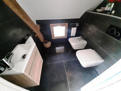 Master suite toilet, bidet and wash basin.