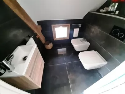 Master suite toilet, bidet and wash basin.