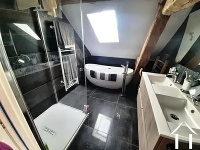Bathroom with bath, shower and double wash basins