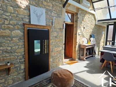 Wood stove in glass extension