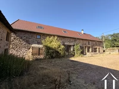 Beautifully renovated large farmhouse with barn and outbuilding featuring a covered terrace. Surrounded by a stunning landscape with 9500m2 of land in the Brionnais Ref # DF5690C 