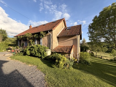 Beautiful comfortable house located in a small hamlet with a large stone barn, outbuildings, and garage on over 4000m2.